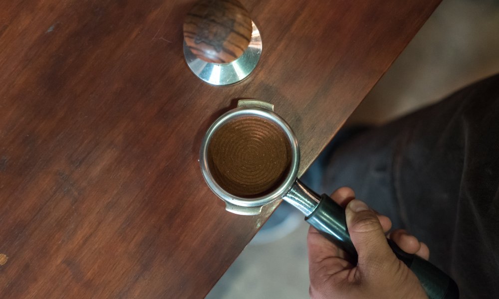 Apisonamiento de café molido