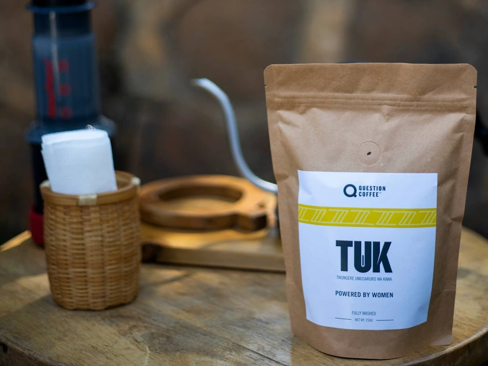 A bag of Question Coffee next to a pour over kettle.